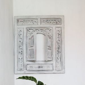 Hand-carved Balinese wood window wall decor with intricate whitewashed floral patterns