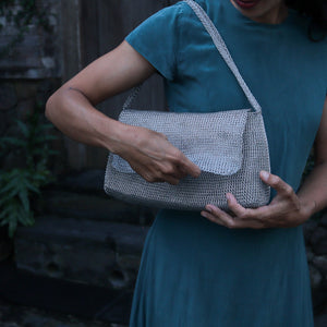 Wire Mesh Hand Woven Bag Melati showcased in use, highlighting its unique handwoven design and eco-friendly nature.