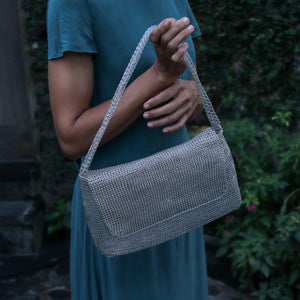 Wire Mesh Hand Woven Bag Melati held by a person showcasing its sustainable eco-tote design.
