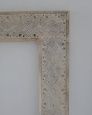 Hand carved ethnic mirror frame in white wash finish, intricate patterns on wood, 180x90 cm, unique Bali craftsmanship.