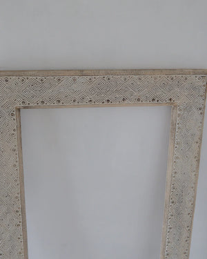 Hand carved ethnic mirror frame in white wash, 180 x 90 cm, featuring unique motifs and intricate design.