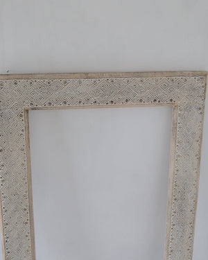 Hand carved white wash mirror frame with intricate ethnic motifs, made from solid wood in Bali.