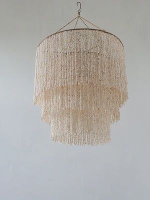 Handmade tiered seashell chandelier with natural beads, boho Balinese decor