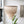 Handmade Balinese seashell chandelier hanging in a modern, minimalist room