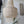 Handmade seashell chandelier with cascading beads, Balinese decor in modern interior.