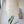 Handmade Balinese seashell chandelier with hanging shell strands in a bright modern room
