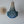 Handmade blue beaded chandelier and woven wall decor on light wall, Balinese style