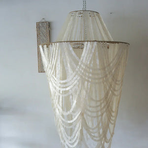 Handmade white seashell chandelier with cascading design, boho tropical home decor