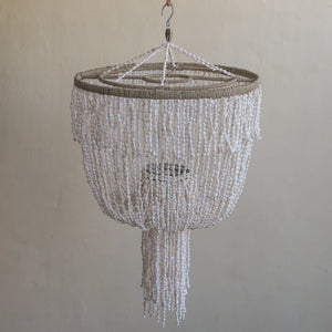 Handmade shell chandelier lampshade with cascading white seashell strands