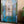 Hand-carved Balinese blue wooden door with ornate white and gold details