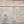 Hand-carved Balinese wooden door with floral and heart patterns, rustic finish