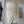 Handmade seashell chandelier hanging in a modern room with sunlight and wall art