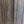 Hand-carved wooden Bali door with intricate floral patterns and natural wood finish