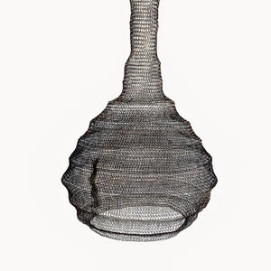 Handmade wire mesh pendant lamp with a bulbous shape on a plain white background