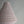 Handmade natural fiber pendant lamp with textured fabric shade against gray wall