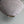 Handmade linen lampshade with natural texture against a light grey wall