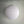 White paper lantern hanging against a plain wall, minimalist home decor lighting