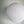 White paper lantern ceiling light with ribbed texture against a plain wall