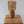 Handmade rattan night lamp with wooden base on wooden table, eco-friendly home decor