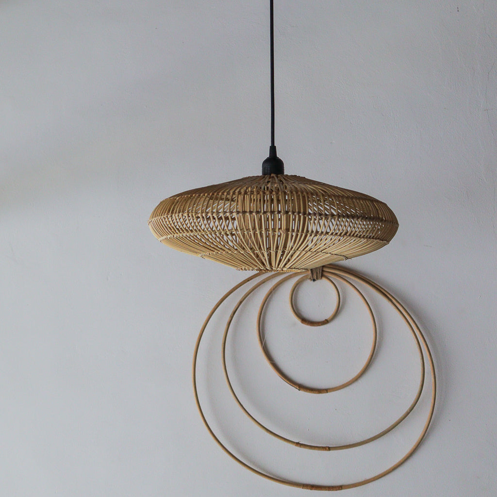 Woven pendant light with circular design on a plain background