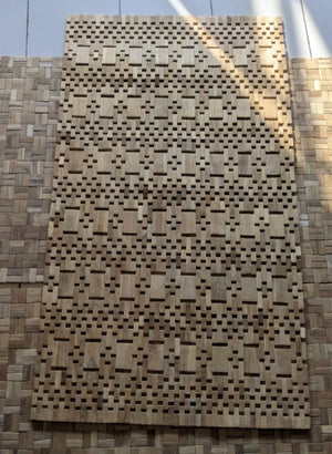 Handcrafted wooden panel with geometric carved pattern, eco-friendly home decor