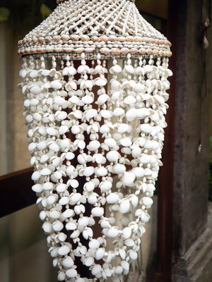 Handmade Balinese seashell chandelier with intricate hanging shell strands, boho home decor