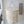 Handmade seashell chandelier with woven detail hanging in modern living room