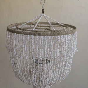 Handcrafted vintage seashell chandelier with natural beads and boho decor style