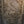Hand-carved Balinese wooden wall panel with intricate floral and mythical face details