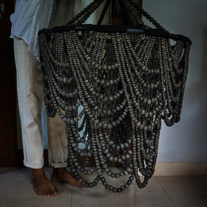 Handmade dark wood bead chandelier with cascading strands, artisan home decor