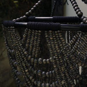Handcrafted wooden beaded chandelier with intricate natural black rope detailing