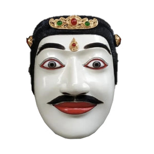 Hand-carved white wooden theater mask with black hair, mustache, crown, and red lips