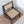 Handcrafted wooden dining chair with woven rattan seat and backrest on textured rug