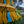 Handmade yellow gold fringe with blue tassels and beads, outdoor Balinese decor detail