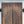 Hand-carved Balinese wooden double door with intricate floral patterns