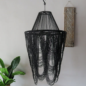 Black beaded chandelier handcrafted in Bali, featuring unique motifs and free shipping options.