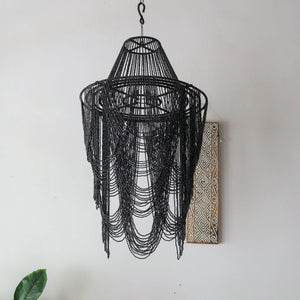 Unique black beaded chandelier handcrafted in Bali, Indonesia, showcasing intricate design and character.