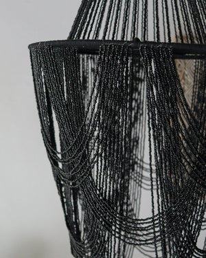 Elegant black beaded chandelier showcasing intricate handcrafted details, perfect for unique home decor.