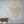 Bohemian capiz shell chandelier with wooden bedside table in a minimal room