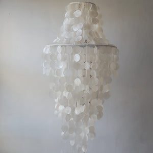 Handmade capiz shell chandelier in white, cascading layers for elegant home decor