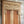Hand-carved Balinese wooden door with intricate floral and geometric details