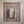 Hand-carved wooden window frame with intricate Balinese floral patterns