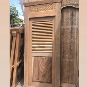 Hand-carved Balinese wooden door with louvered panel and intricate top detailing