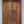 Hand-carved Balinese wooden door with intricate floral patterns and ornate detailing