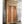 Hand-carved Balinese wooden door with intricate ethnic patterns and ornate detailing