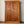Hand-carved Balinese double wooden door with intricate patterns and metal ring handles
