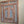 Hand-carved Balinese wooden window frame with intricate floral and geometric designs