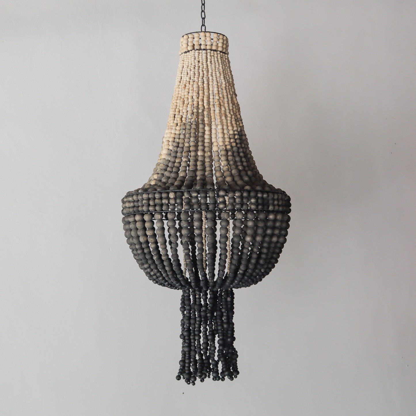 Beaded chandelier with ombre color design, handcrafted in Bali, featuring a unique pattern and texture.