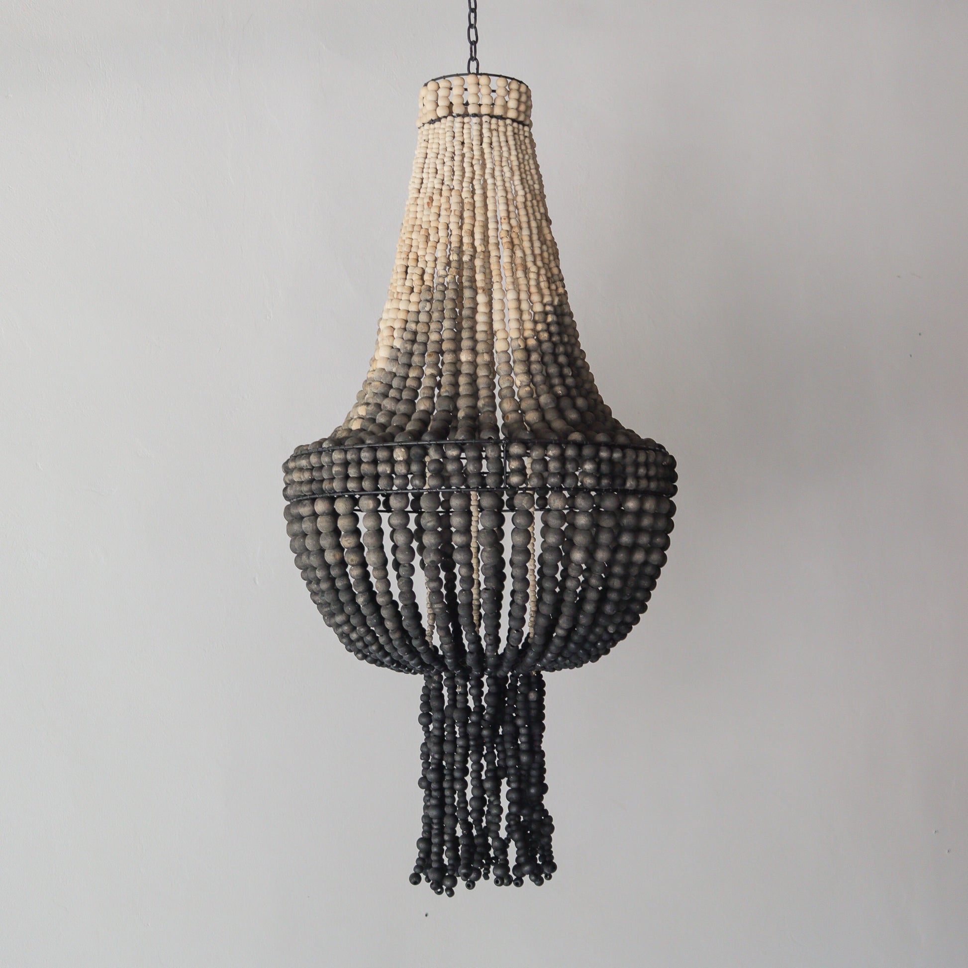 Beaded chandelier with ombre color design, handcrafted in Bali, featuring a unique pattern and texture.