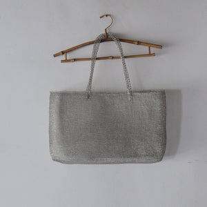 wire mesh hanging on the white wall